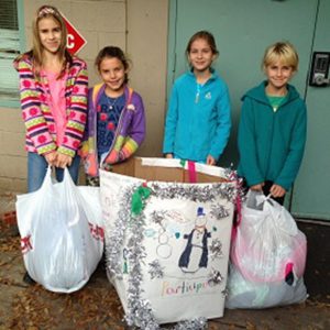 Kids help drop off donations for the families in Hagar’s House